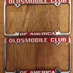 NOS Oldsmobile Club of America automobile license plate frame, pair, red/white