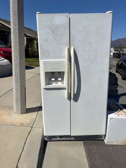 White Side-by-Side Refrigerator with Ice and Water Dispenser