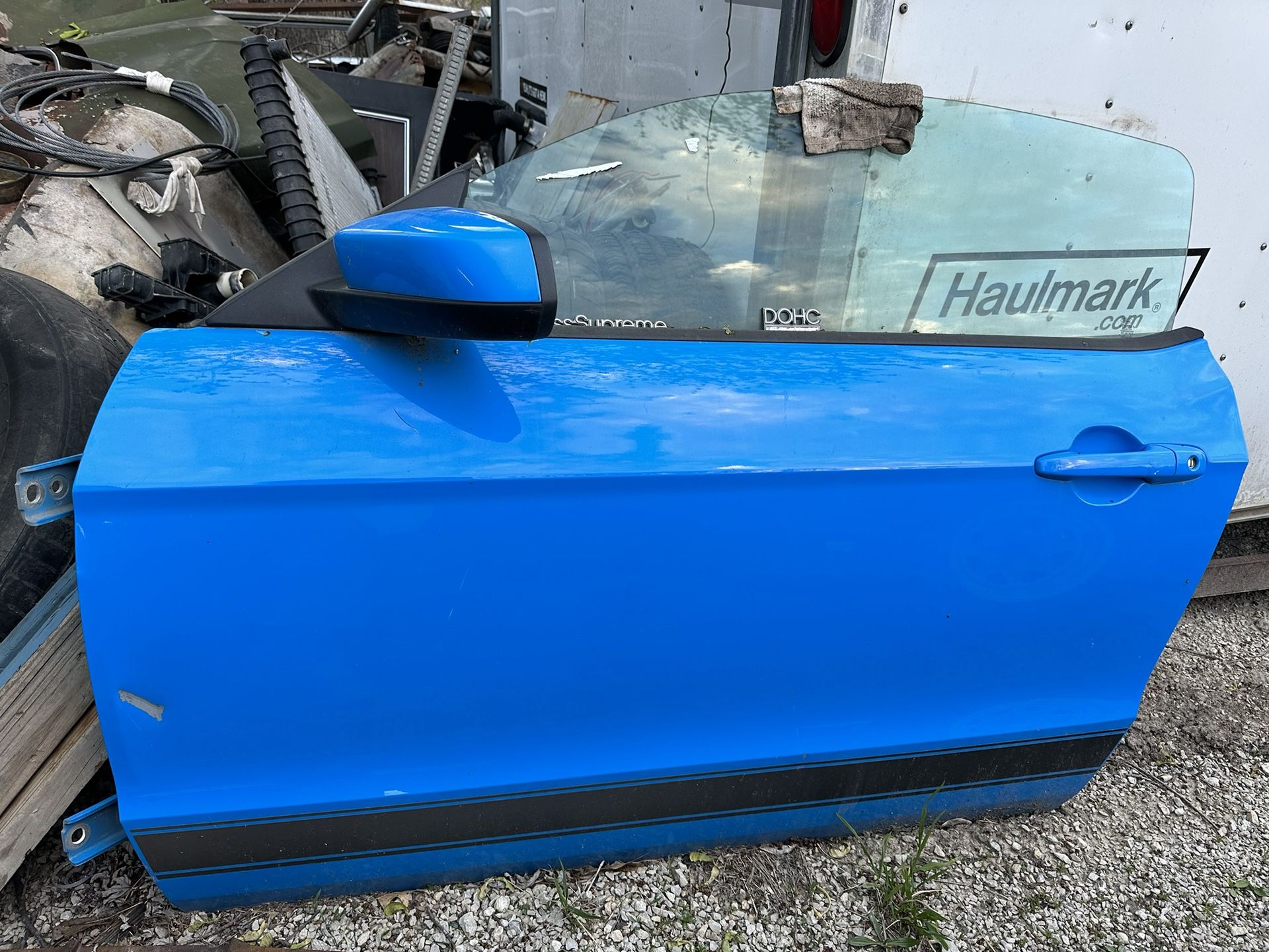 2013 mustang Drivers Door with power mirror. No door panel has minor damage from storage on fron