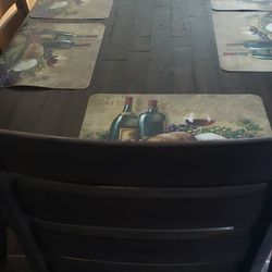 Ashley dinner table with 4 chairs and a bench that can seat up to 3