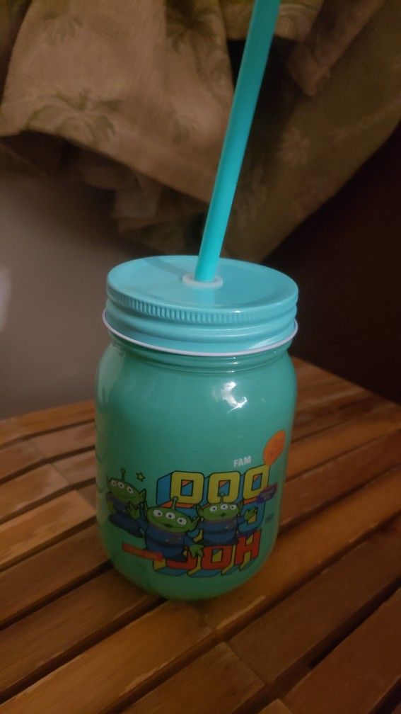 New green mason cup with lid and straw. pixar alien from toy story