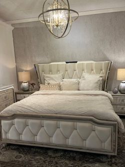 Ivory upholstered bedroom set features tufted wingback & led light