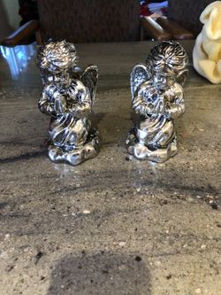 Kneeling angel candle holders
