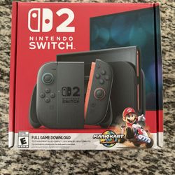 Nintendo Switch 2 With Mario Kart World Bundle In Hand