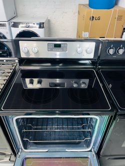 Whirlpool black electric stove—includes a receipt for a 90-day warranty.
