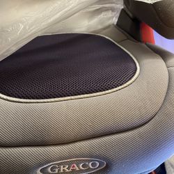 Graco booster seat. Light gray color.  Clean.