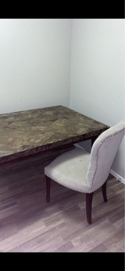 Granite table and suede tufted chairs