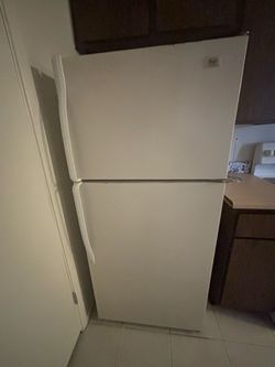 White fridge. Working