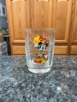Walt Disney World 2000 Mcdonald's Commerative Glass Featuring Minnie Mouse.  Size approximately 4 1/2 inches tall.  Has been on display in a cabinet.