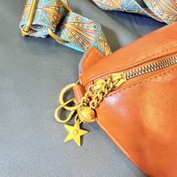 Brown Crescent Crossbody Bag with Patterned Strap, Star Charm, Gold Hardware