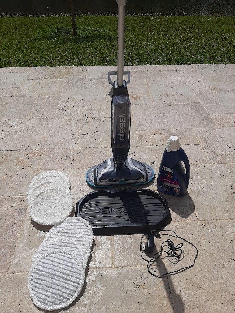 Bissell spinwave cordless hard floor spin mop with pads and  Bissell floor cleaner bottle Like NEW