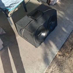 This is a Q Power dual subwoofer enclosure featuring 12-inch  subs  