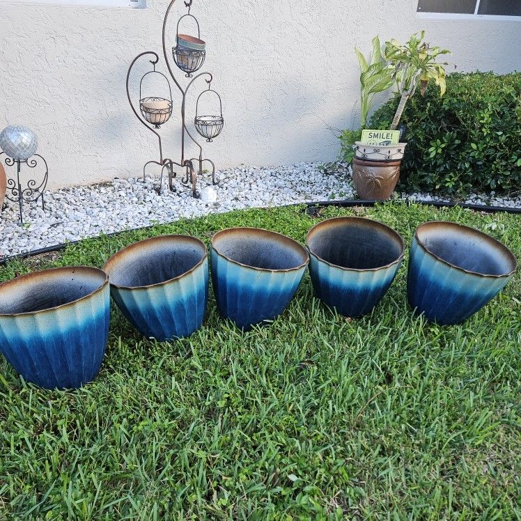 5 COMPOSITE PLANT POTS. 17IN HI AND WIDE $10 EACH
