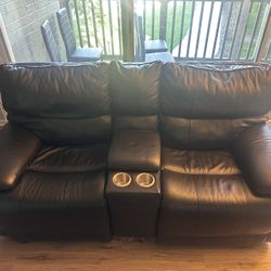 Comfortable two-seater black leather loveseat recliner