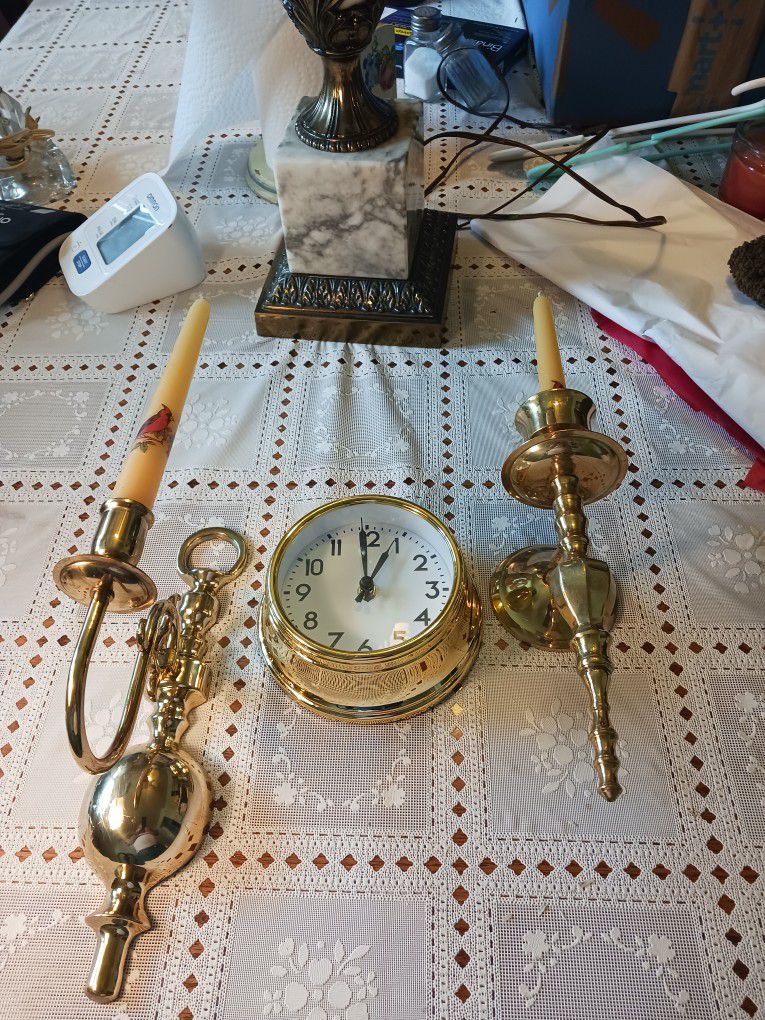 REALLY NEAT LOOKING  Solid Brass  Candle HOLDER AND   THE CANDLE CAME FROM HONG KONG  THE CLOCK WORKS GREAT 