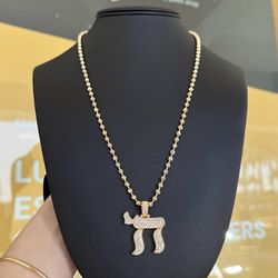 14k yellow gold diamond Chai pendant and 18k yellow gold half of moon chain 22”