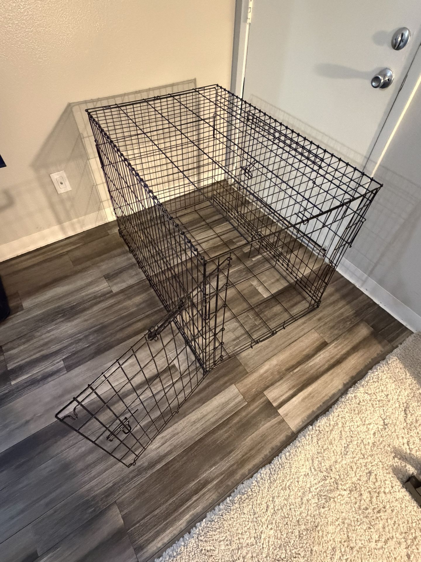 large, black wire dog crate