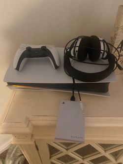 PS5 with one controller headset, and a Seagate for extra space