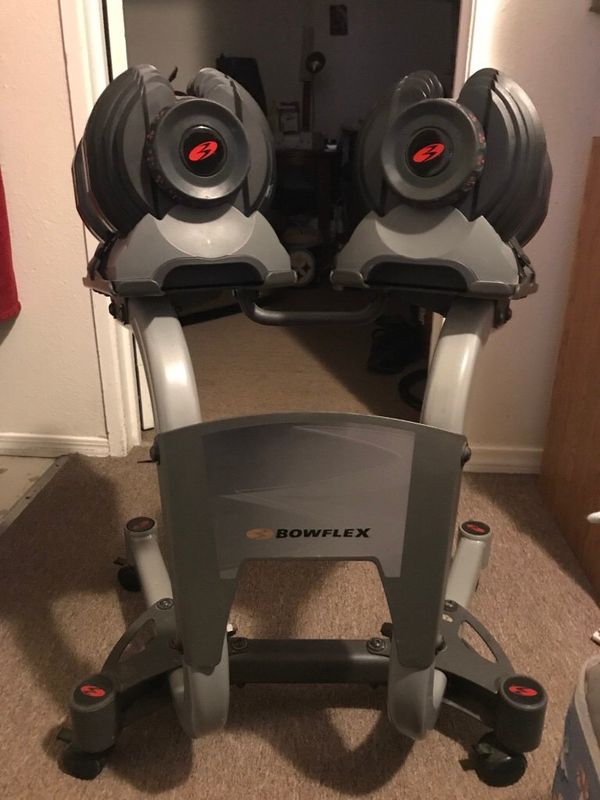 Bowflex select tech 1090 dumbbells. Includes Bowflex select tech mobile stands with wheels for ...