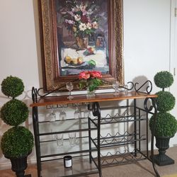 Large wood and metal wine rack table. Solid piece.