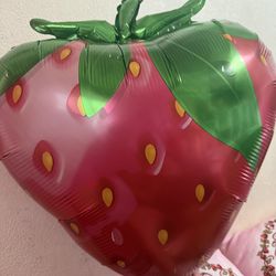 inflated strawberry balloons