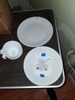A partial of Winter White Corelle dishes