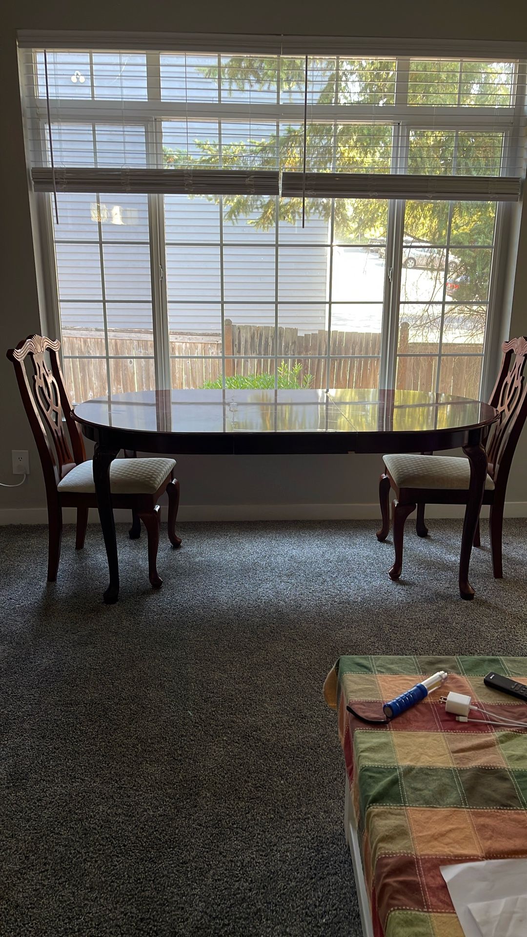 Classic lacquered table with addition to extend the table and two wooden chairs.