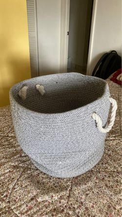 Gray clothing basket