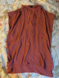 Orange sleeveless blouse