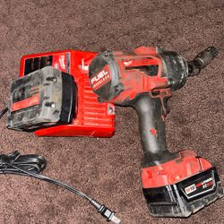 Impact drill with battery and charger