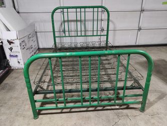 Old vintage metal bed with springs.
