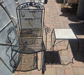 $150 IRON ROCKING CHAIR AND TABLE