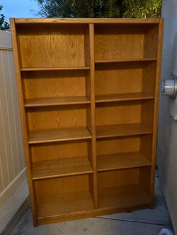 Light brown large wooden bookshelf
