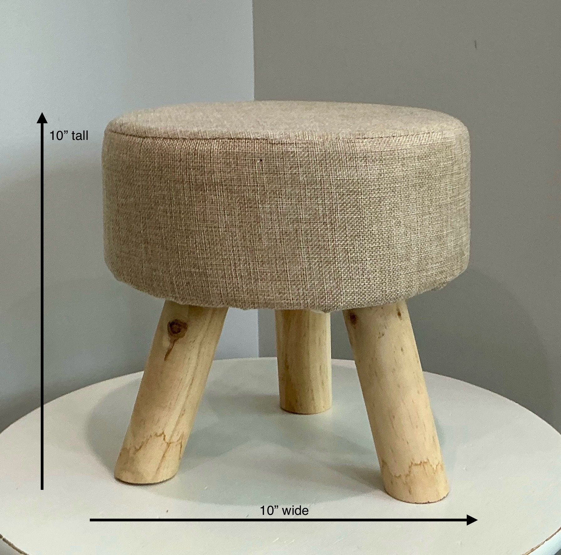 Greenbrier International Small Tan & White Cushioned Footstool with 3 Light Colored Wood Legs