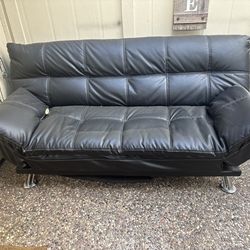 Versatile Black Leather Sofa Bed for Sale - Great Condition!