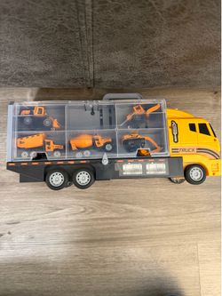 Container truck with construction vehicles