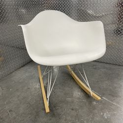 Herman Miller Eames plastic molded shell chair on rocking chair base near Miami Design District 