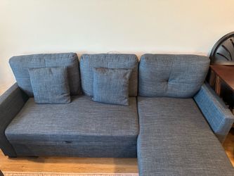 Blue Sleeper Sofa with Storage – Good Condition