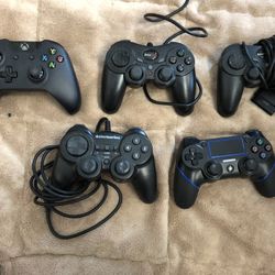 Set Of 4 Video Game Remote Controllers