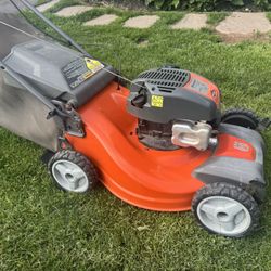 Husqvarna AWD Self Propelled Mower 163cc Engine With 21” Cutting Deck And Bag. Must Pickup