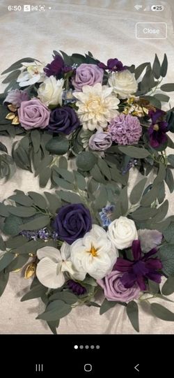 2 purple, lavander and white faux flower arrangements for arch