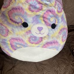 large Squishmallow plush toy, specifically the character Jonessa the Bear.