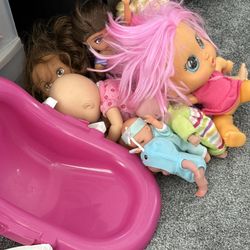 Baby Dolls And Dolls And A Carrying Seat