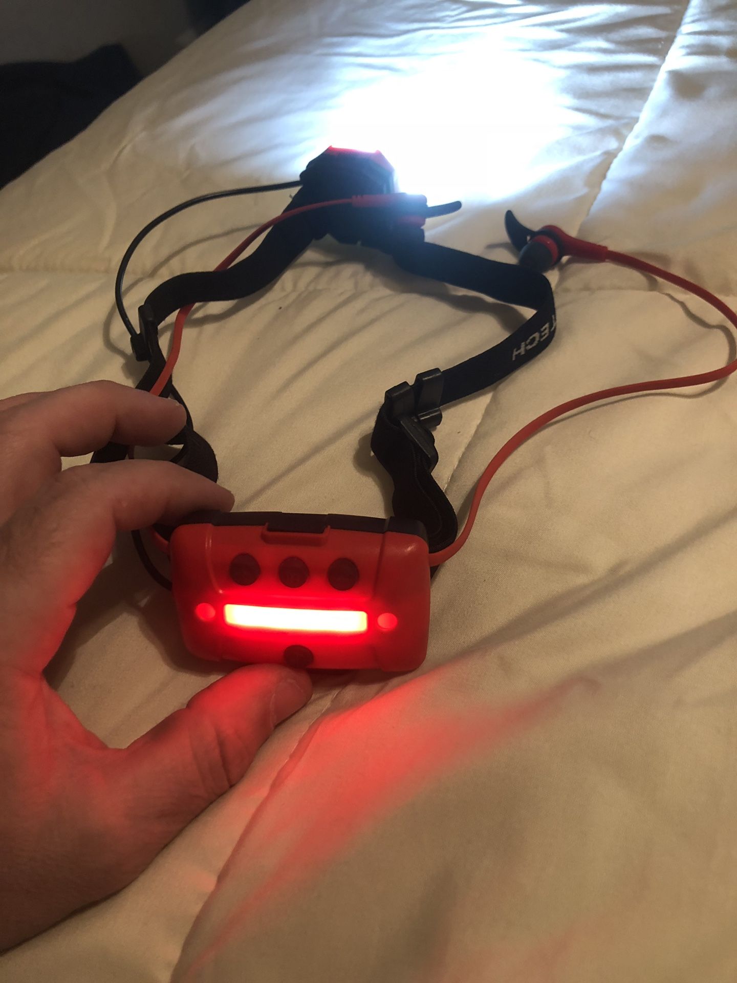 Headlight with Bluetooth earphones.