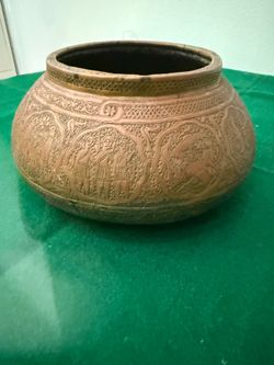 Engraved copper bowl.