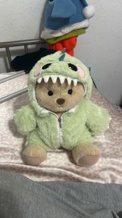 Bear with dinosaur outfit