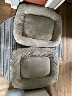 Two large dog beds