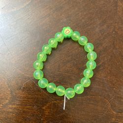 green bracelet happy face charm