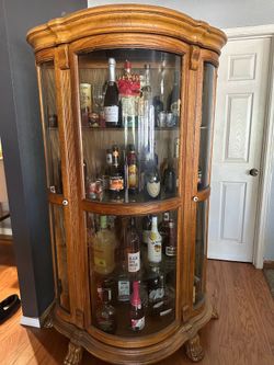 Wooden bar cabinet with glass doors