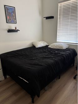 Full size bed, black frame, pillows